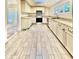 Modern kitchen with granite countertops, stainless steel appliances, and skylight at 1109 Belcher Rd, Palm Harbor, FL 34683