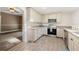 Charming kitchen featuring granite countertops and stainless steel appliances at 1109 Belcher Rd, Palm Harbor, FL 34683