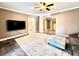 Living room with a ceiling fan, an area rug, and arched doorways at 1109 Belcher Rd, Palm Harbor, FL 34683