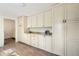 Pantry offers ample storage with custom cabinetry at 1109 Belcher Rd, Palm Harbor, FL 34683