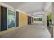 View of the covered portico highlighting the entrance and architectural details at 1109 Belcher Rd, Palm Harbor, FL 34683