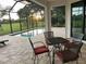 Relaxing pool area with patio furniture and screened enclosure at 7101 N Plum Tree, Punta Gorda, FL 33955