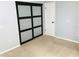 Bedroom with sliding closet doors and carpet flooring at 10425 La Mirage Ct # 202, Tampa, FL 33615