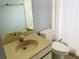 Clean bathroom with a toilet, sink, and shower/tub combo at 10425 La Mirage Ct # 202, Tampa, FL 33615