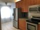 Bright kitchen with stainless steel appliances and granite countertops at 10425 La Mirage Ct # 202, Tampa, FL 33615