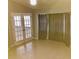 Bright dining area with French doors and large windows at 10425 La Mirage Ct # 202, Tampa, FL 33615