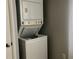Stackable washer and dryer in the laundry room at 10425 La Mirage Ct # 202, Tampa, FL 33615