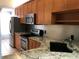 Modern kitchen with stainless steel appliances at 10425 La Mirage Ct # 202, Tampa, FL 33615