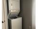 Stackable washer and dryer in a small laundry room at 10425 La Mirage Ct # 202, Tampa, FL 33615