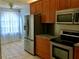 Kitchen with stainless steel appliances and granite countertops at 10425 La Mirage Ct # 202, Tampa, FL 33615