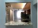 Kitchen features granite countertops and wood cabinets at 10425 La Mirage Ct # 202, Tampa, FL 33615