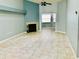 Living room with fireplace and tiled floors at 10425 La Mirage Ct # 202, Tampa, FL 33615