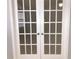White French doors with glass panes at 10425 La Mirage Ct # 202, Tampa, FL 33615