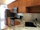 Modern kitchen with stainless steel appliances at 10425 La Mirage Ct # 202, Tampa, FL 33615