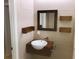 Modern bathroom with floating vanity and mirror at 10425 La Mirage Ct # 202, Tampa, FL 33615