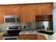 Modern kitchen with stainless steel appliances at 10425 La Mirage Ct # 202, Tampa, FL 33615