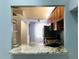 Kitchen features granite countertops and wood cabinets at 10425 La Mirage Ct # 202, Tampa, FL 33615