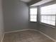Bright spare room with large window and neutral walls at 10425 La Mirage Ct # 202, Tampa, FL 33615