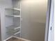 White pantry with wire shelving offering ample storage at 10425 La Mirage Ct # 202, Tampa, FL 33615
