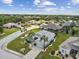 Aerial view of a single-Gathering home in a residential community with palm trees and lush landscaping at 1119 Villeroy Dr, Sun City Center, FL 33573