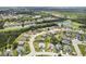 Aerial view of a golf course community with numerous houses and lush landscaping at 1119 Villeroy Dr, Sun City Center, FL 33573