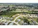 Wide aerial view of a large community with golf course at 1119 Villeroy Dr, Sun City Center, FL 33573