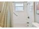 Bathroom with a shower/tub combo and linen closet at 1119 Villeroy Dr, Sun City Center, FL 33573