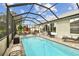 Enjoy this refreshing screened pool with ample seating at 1119 Villeroy Dr, Sun City Center, FL 33573