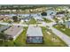 Aerial view showcasing a house with a pool in a residential community at 1119 Villeroy Dr, Sun City Center, FL 33573