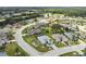 Aerial view of a residential neighborhood with lush landscaping at 1119 Villeroy Dr, Sun City Center, FL 33573