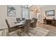 Open concept dining room with hardwood floors and stylish decor at 1119 Villeroy Dr, Sun City Center, FL 33573