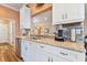 Modern kitchen with white cabinets and granite countertops at 1119 Villeroy Dr, Sun City Center, FL 33573