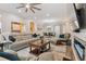 Spacious living room featuring a fireplace and ample seating at 1119 Villeroy Dr, Sun City Center, FL 33573