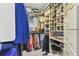 Large walk-in closet with ample shelving and hanging space at 1119 Villeroy Dr, Sun City Center, FL 33573