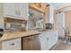 Modern kitchen with stainless steel appliances and white cabinetry at 1119 Villeroy Dr, Sun City Center, FL 33573
