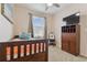 Cozy bedroom with wood bed frame and built-in shelving at 1119 Villeroy Dr, Sun City Center, FL 33573