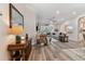 Open living room with hardwood floors and ample natural light at 1119 Villeroy Dr, Sun City Center, FL 33573