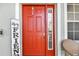 Red front door with Hey Friends sign at 1119 Villeroy Dr, Sun City Center, FL 33573