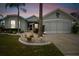Well-maintained house with a two-car garage and landscaping at 1119 Villeroy Dr, Sun City Center, FL 33573