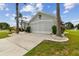 Front exterior view of house with driveway and landscaping at 1119 Villeroy Dr, Sun City Center, FL 33573