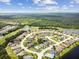 Aerial view of a luxury community with golf course and lake at 1119 Villeroy Dr, Sun City Center, FL 33573