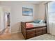 Small bedroom with wood bed frame and drawers underneath at 1119 Villeroy Dr, Sun City Center, FL 33573