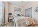 Cozy bedroom featuring a comfortable bed, nightstand, and window at 1119 Villeroy Dr, Sun City Center, FL 33573