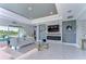 Spacious living room features a fireplace and large sliding glass doors at 2406 High Tides Way, Wesley Chapel, FL 33543