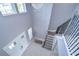 Elegant two-story entryway with double doors and a crystal chandelier at 2406 High Tides Way, Wesley Chapel, FL 33543