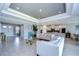 Open living room with high ceilings and a view into the kitchen at 2406 High Tides Way, Wesley Chapel, FL 33543