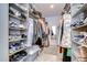 Large walk-in closet with ample shelving and hanging space at 2406 High Tides Way, Wesley Chapel, FL 33543