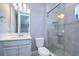 Bathroom with single vanity, quartz countertop and shower at 2406 High Tides Way, Wesley Chapel, FL 33543