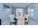 Elegant dining room with a light-colored bench and chairs at 2406 High Tides Way, Wesley Chapel, FL 33543