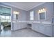 Spacious bathroom with double vanities and a view of the bedroom at 2406 High Tides Way, Wesley Chapel, FL 33543